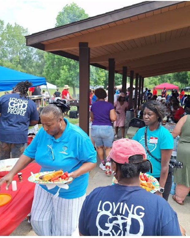 Serving food at the church cookout